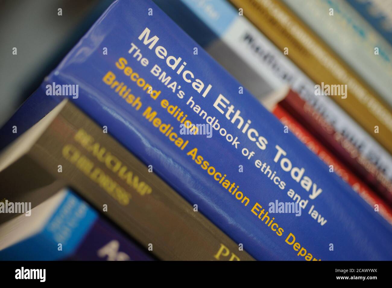 Medical Ethics Today handbook on a book shelf in a library. Stock Photo