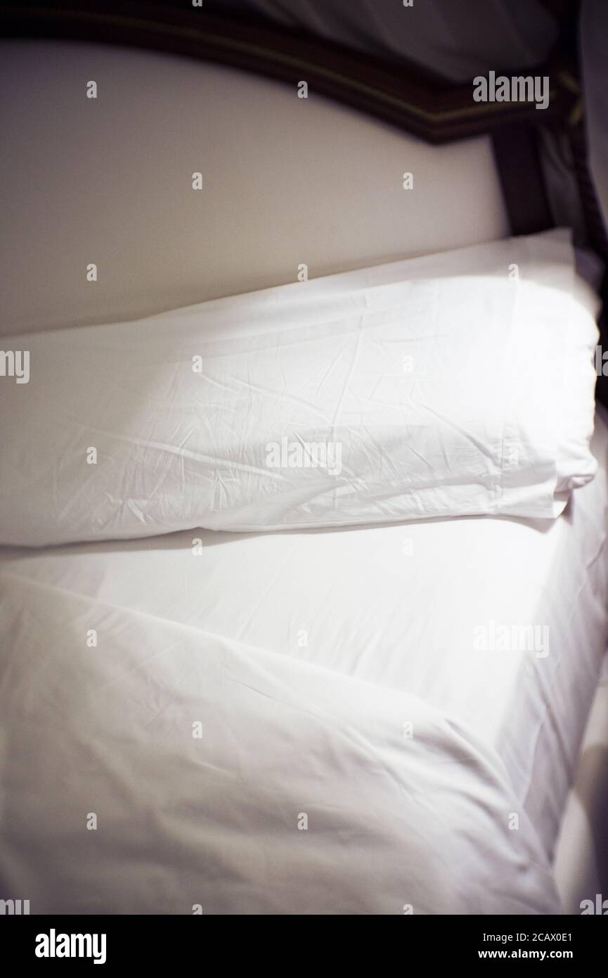 Open bed with bed sheets off. No people Stock Photo Alamy