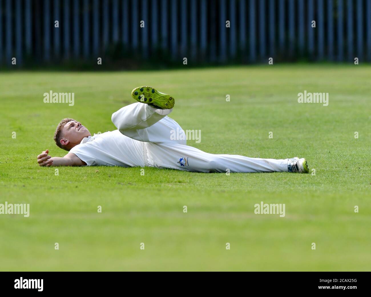 A cricket player loosens up before coming on to bowl in a cricket match Stock Photo Alamy