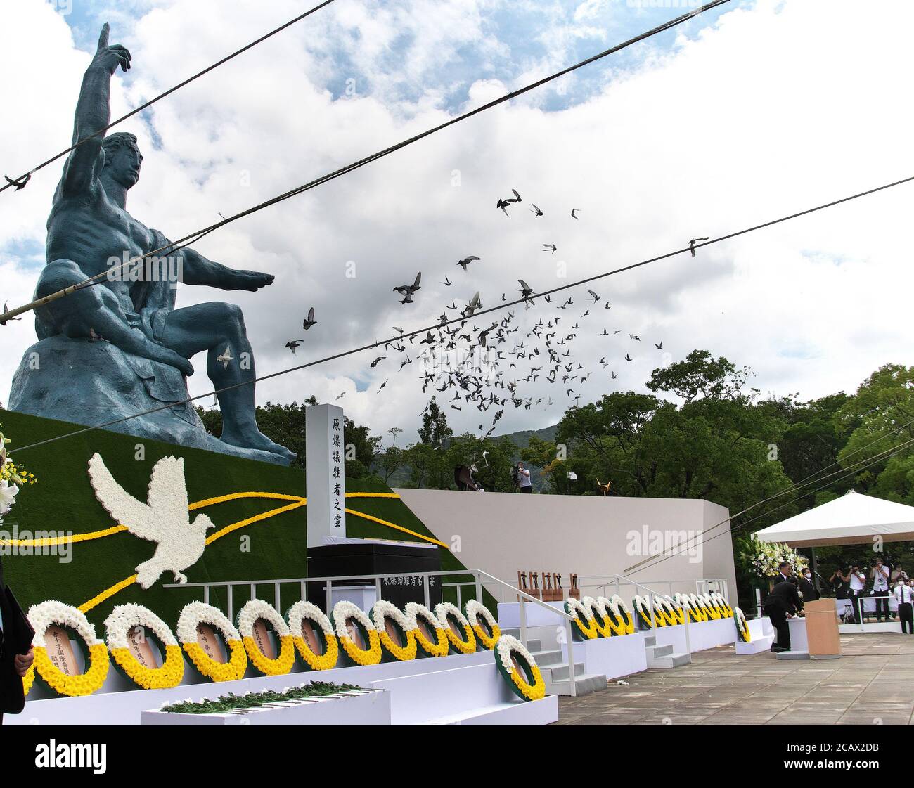 Nagasaki, Japan. 09th Aug, 2020. Released doves fly during the ceremony for the atomic bomb victims marking the 75th anniversary of the atomic bombing of Nagasaki at the Peace Park in Nagasaki, Japan on Sunday, August 9, 2020. The ceremony this year was scaled down to prevent the spread of the novel coronavirus COVID-19. Photo by Kezio Mori/UPI Credit: UPI/Alamy Live News Stock Photo