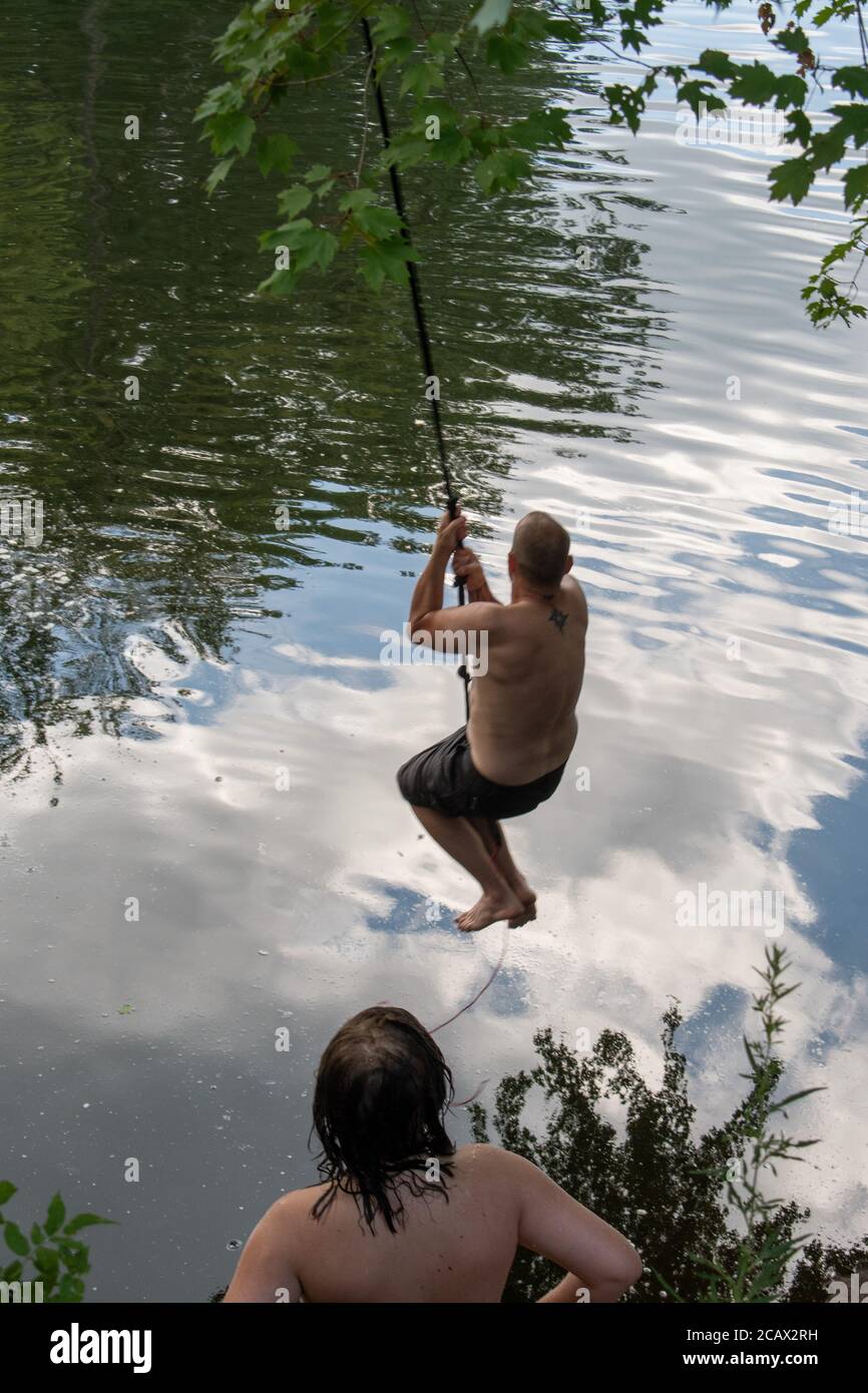 Rope swing into water hi-res stock photography and images - Alamy