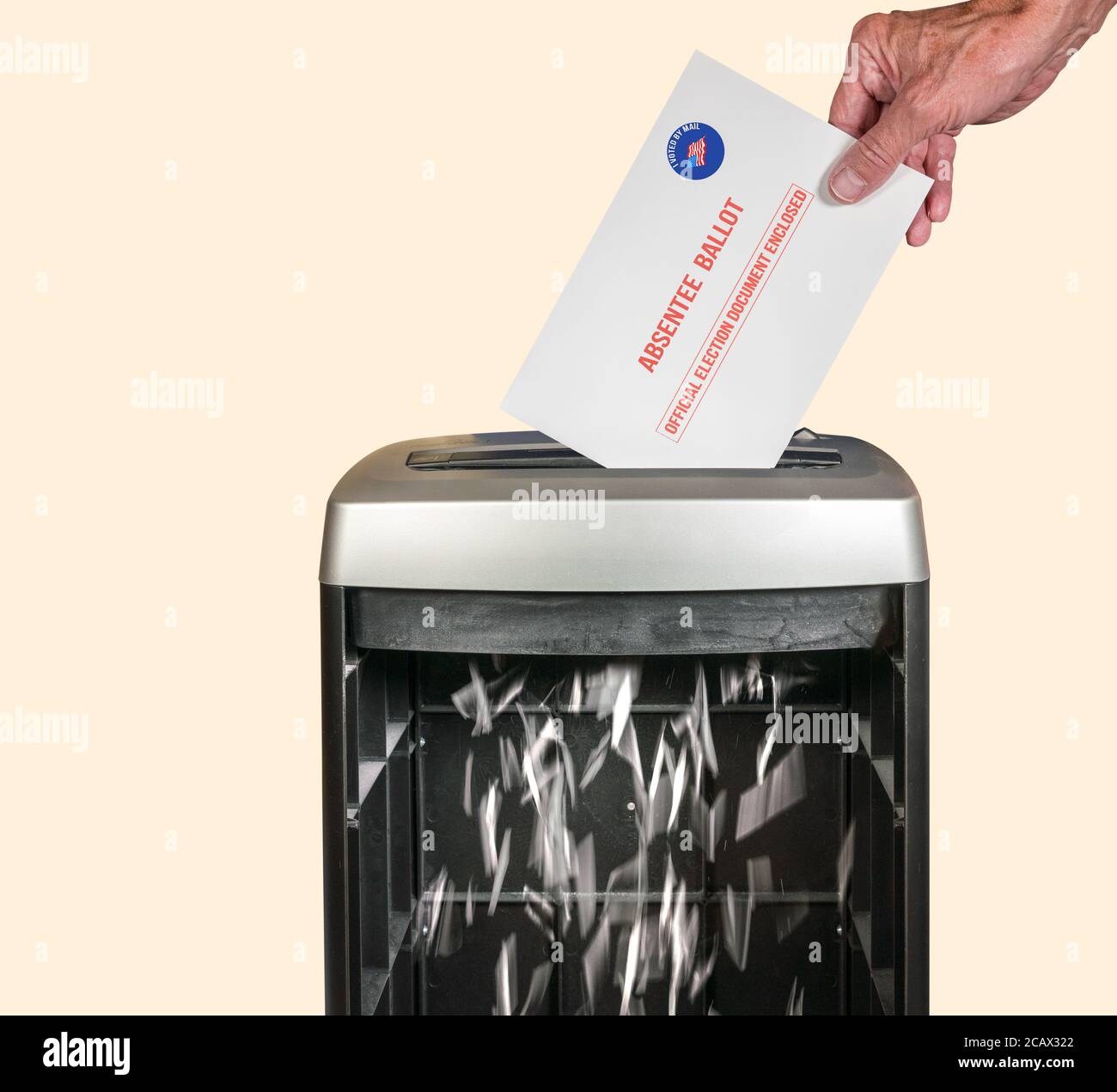 Absentee ballot voteing by mail envelope being shredded in office paper shredder as concept for voting fraud or lost votes in Presidential election Stock Photo