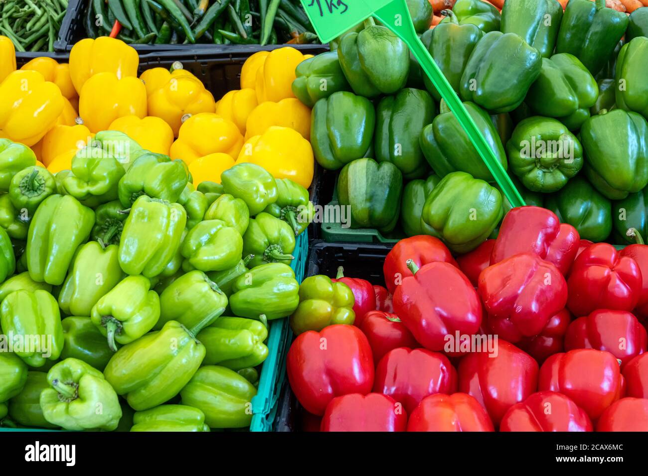 Colorful bell peppers for sale at a market Stock Photo