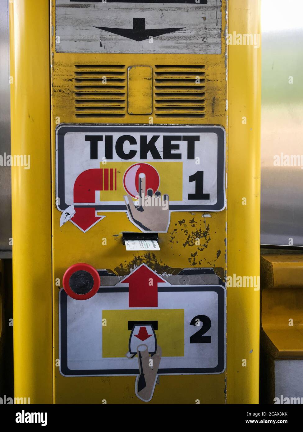 Paper ticket coming out of a slot at Italian highway - autostrade toll booth Stock Photo