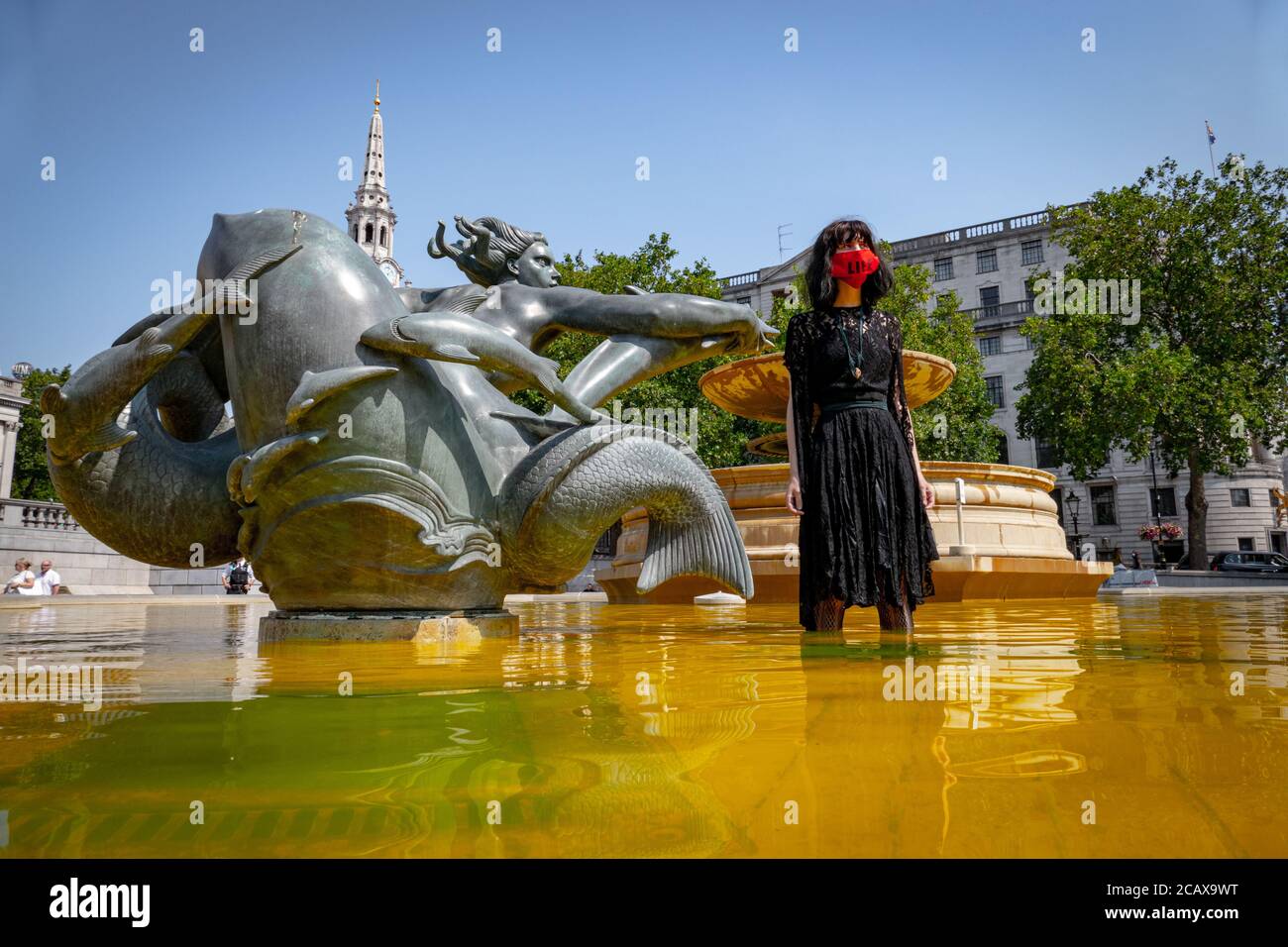 09/08/20 London, UK. XR activists covered the stairs of Trafalgar Sq. with fake blood to mark the International Day of the World’s Indigenous Peoples Stock Photo