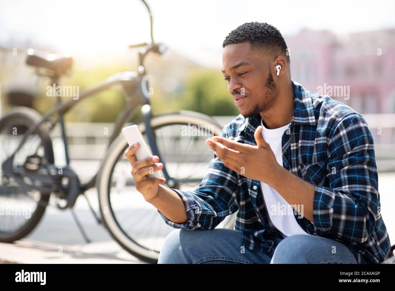 Portrait of african american guy making video call outdoor Stock Photo ...