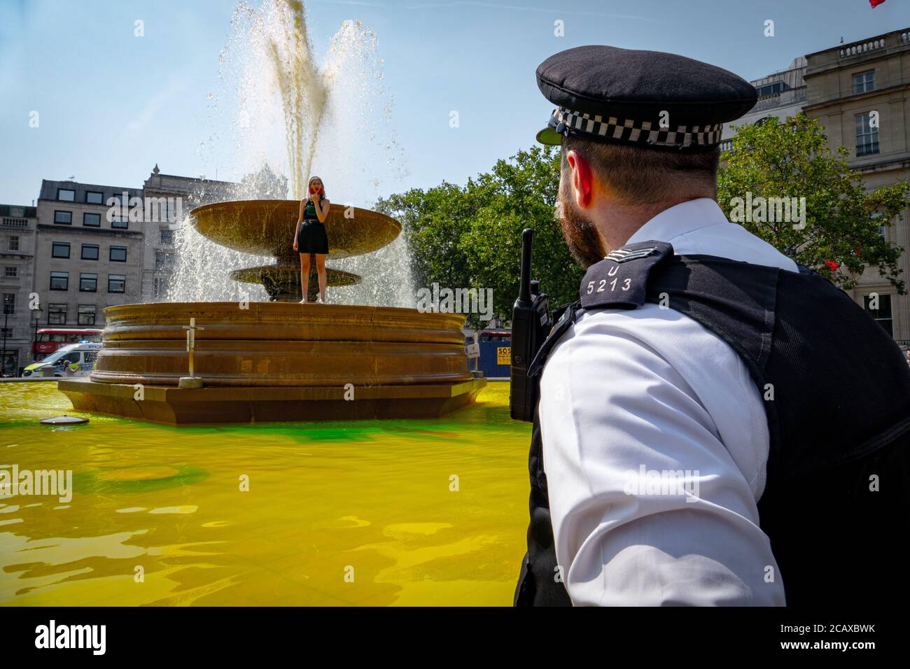 09/08/20 London, UK. XR activists covered the stairs of Trafalgar Sq. with fake blood to mark the International Day of the World’s Indigenous Peoples Stock Photo