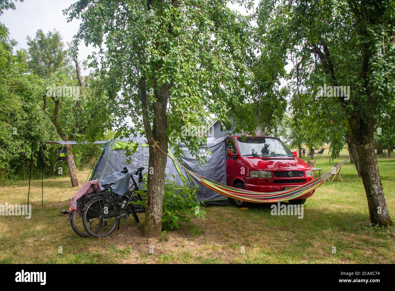 VW T4 camper with bustent at campsite at Neuville Day in Ardennes, France Stock Photo