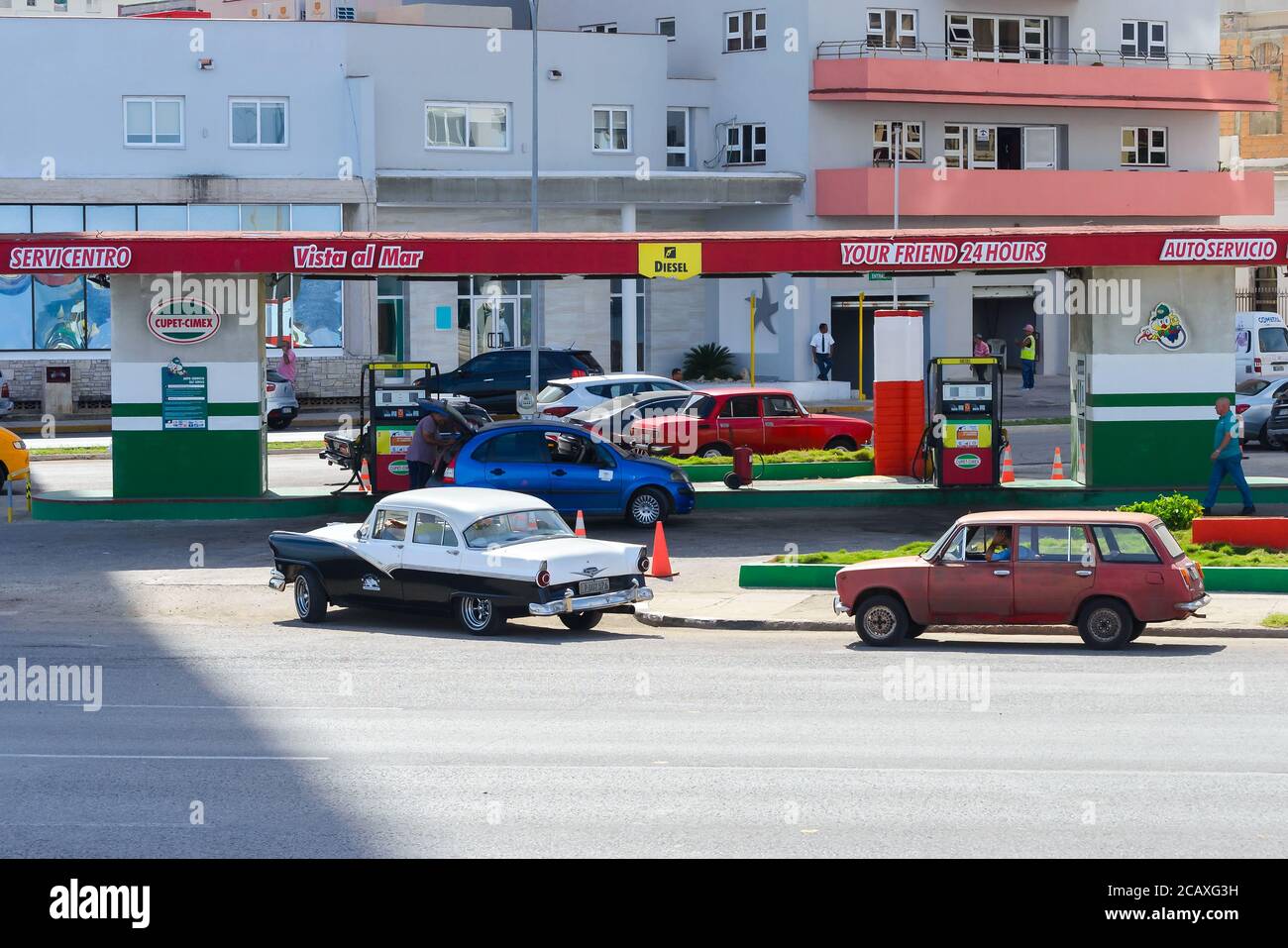 Gas station at Havana, Cuba. Queue of old cars at Cuban oil station in
