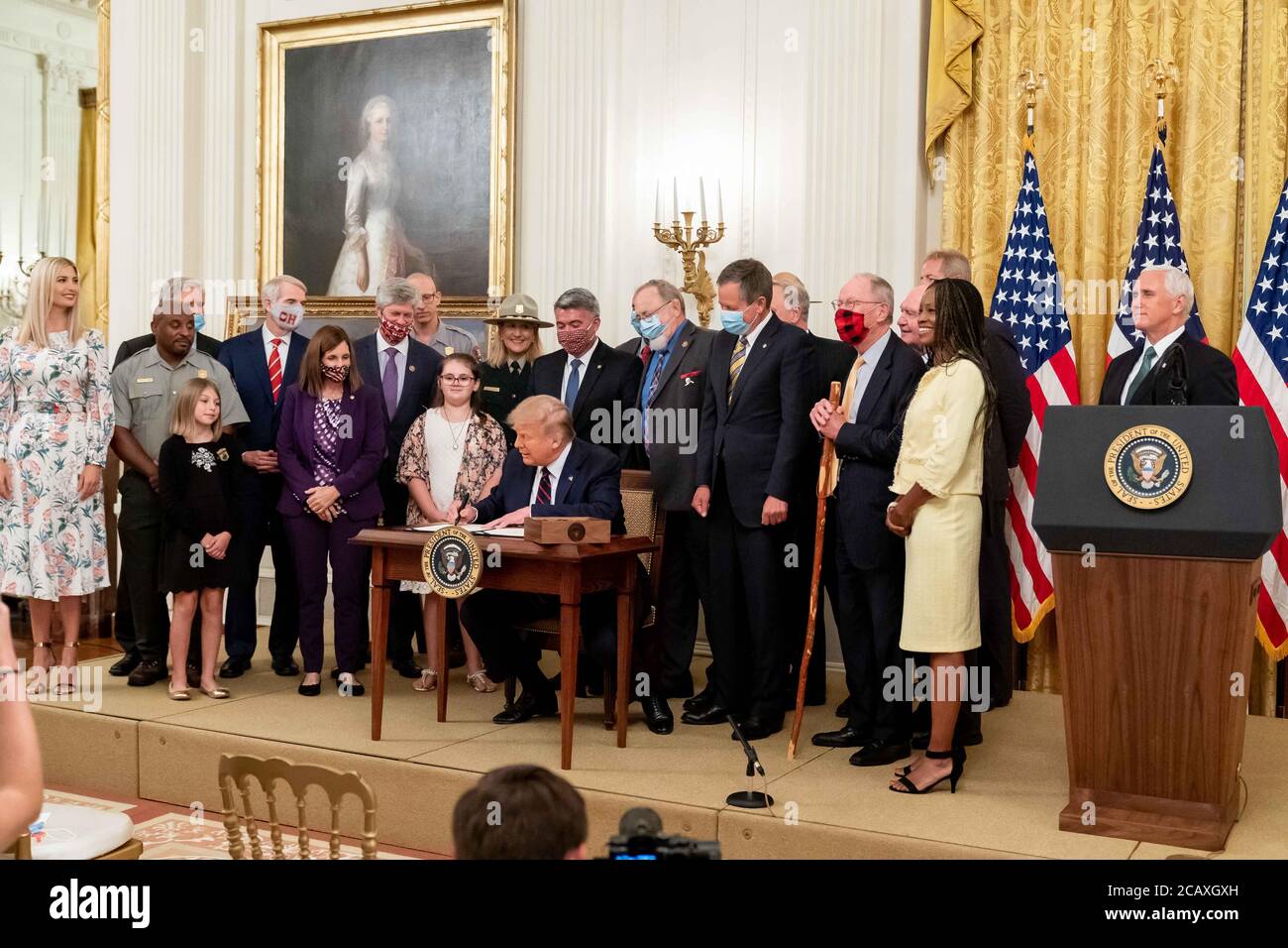 U.S. President Donald Trump signs into law the Great American Outdoors Act during an event in the East Room of the White House August 4, 2020 in Washington, D.C. Stock Photo