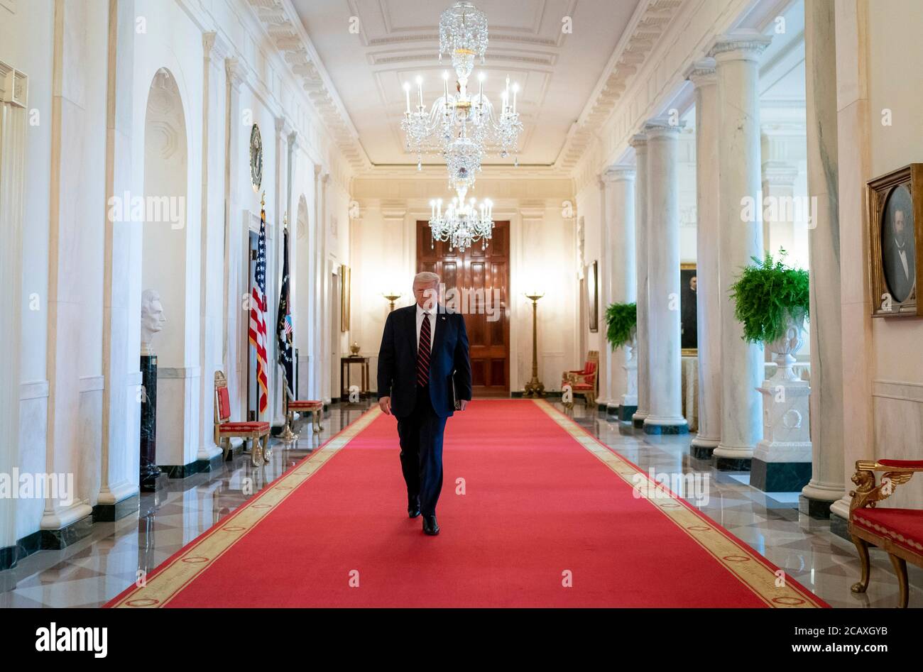 U.S. President Donald Trump arrives for the signing of the Great American Outdoors Act during an event in the East Room of the White House August 4, 2020 in Washington, D.C. Stock Photo