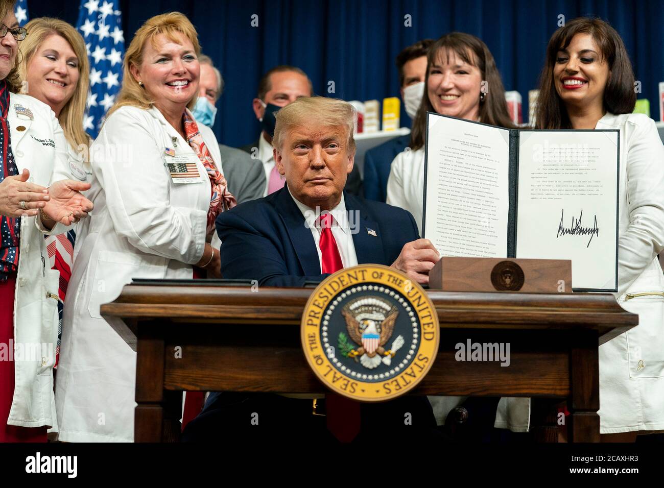 U.S. President Donald Trump holds up the signed Executive Order on lowering drug prices in the South Court Auditorium in the Eisenhower Executive Office Building July2 4, 2020 in Washington, D.C. Stock Photo