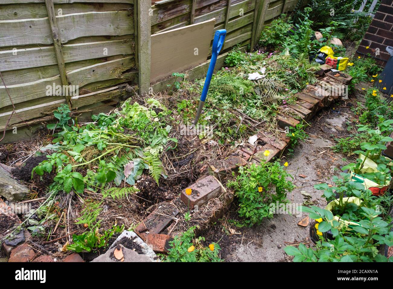 Compost heap by side of house Stock Photo Alamy
