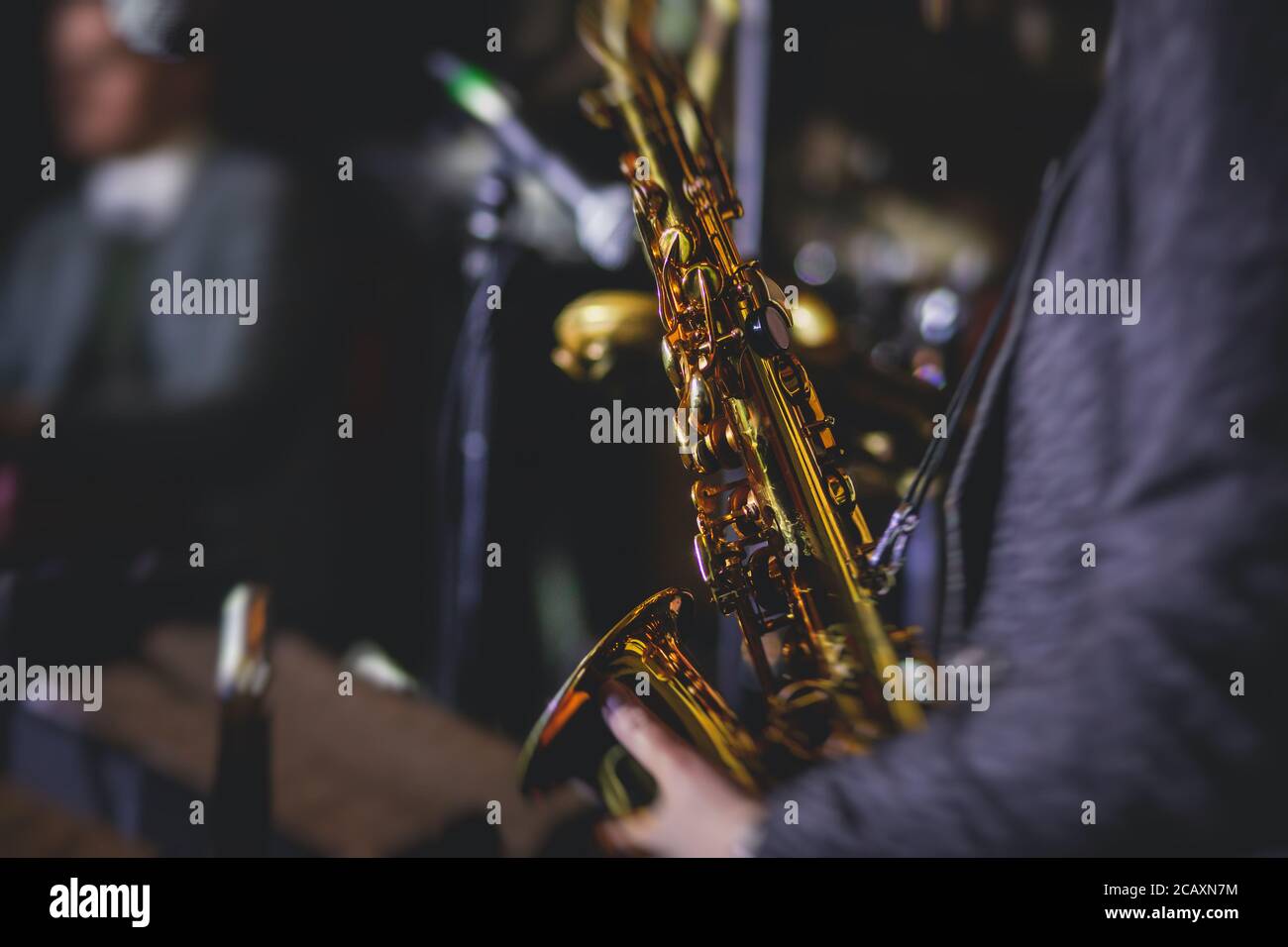 Concert view of a female saxophonist, professional saxophone player
