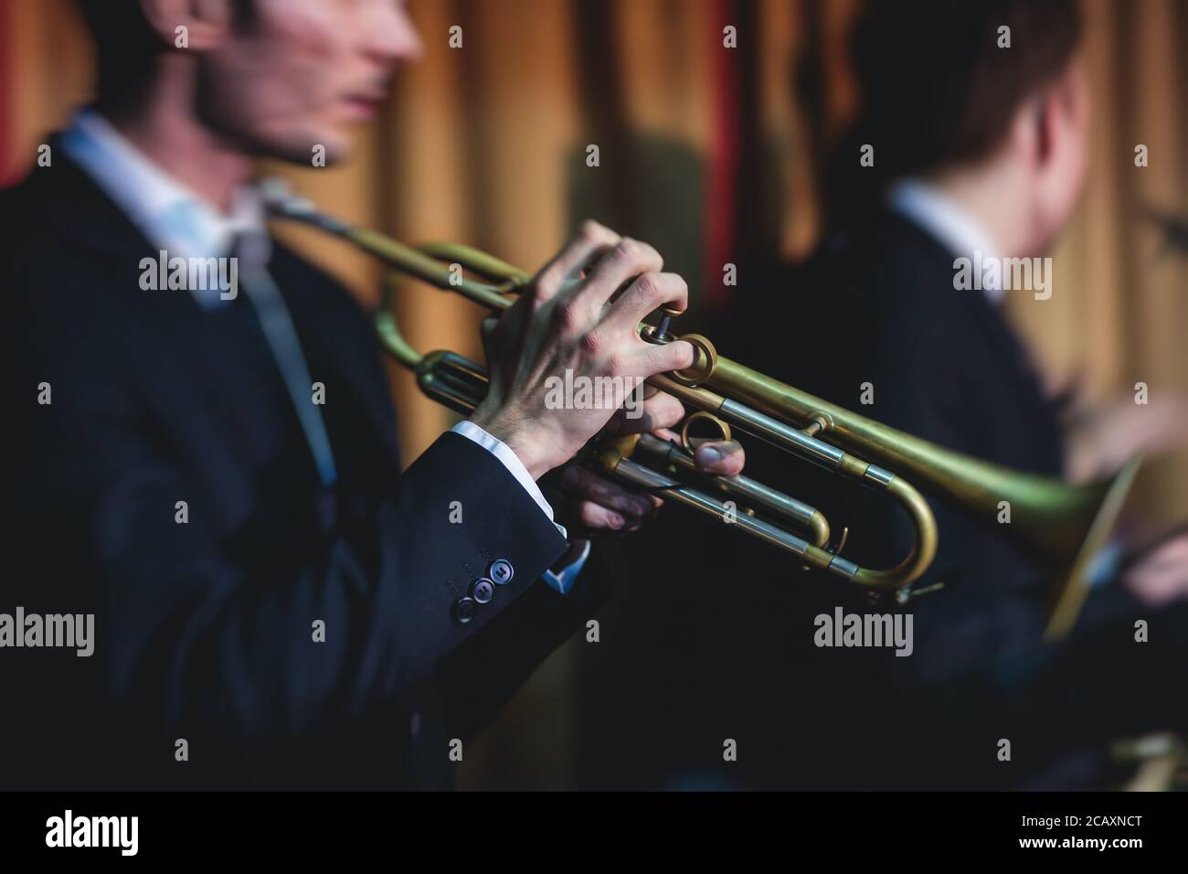 Concert view of a male trumpeter, professional trumpet player with