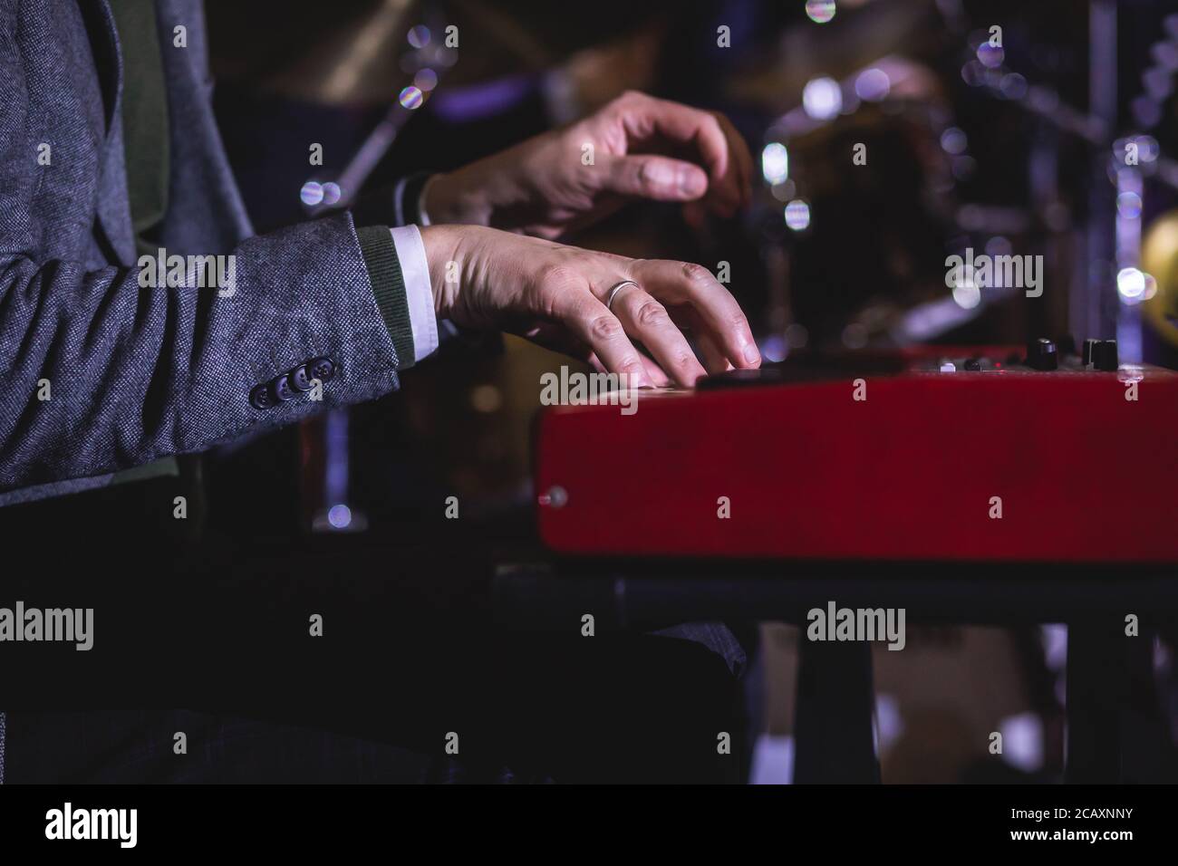 Concert view of a musical keyboard piano player during musical jazz