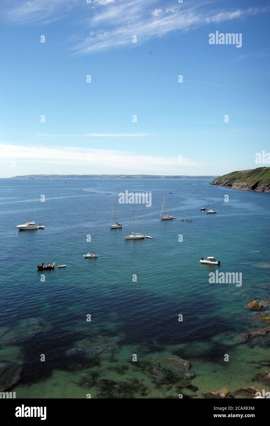 Power boats are moored  in the clear water off Towan Beach in Cornwall, Britain July 12, 2020. Photograph John Voos Stock Photo