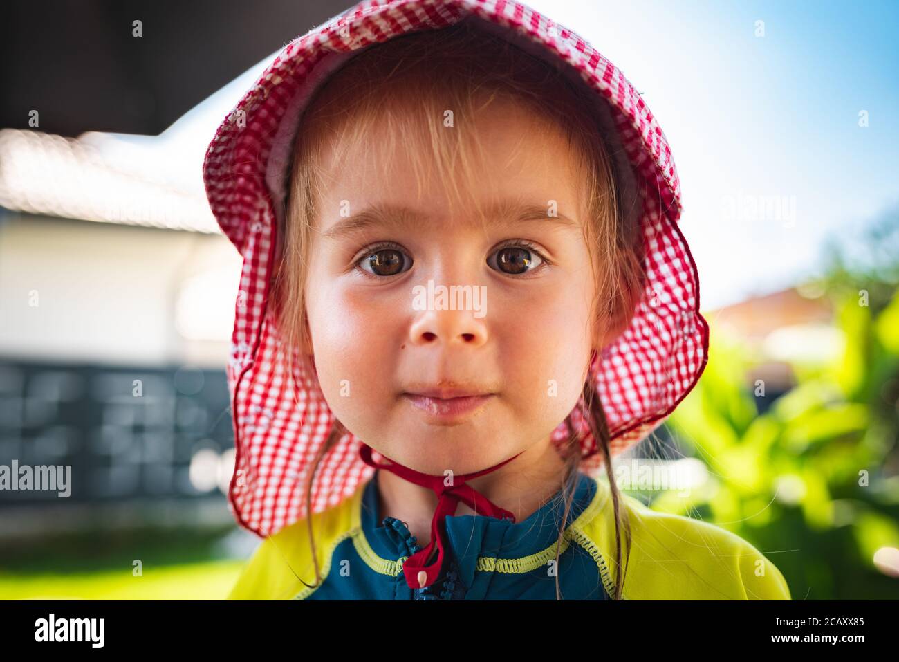 Portrait of very sweet little child with big eyes. 2 year old baby girl. Stock Photo