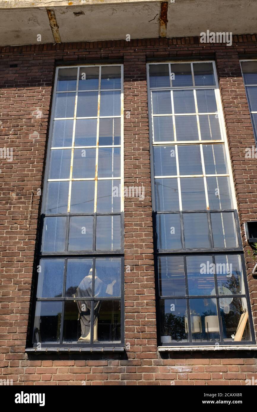 Abandoned industrial warehouse building on old industrial park called Hembrug in the Netherlands Stock Photo