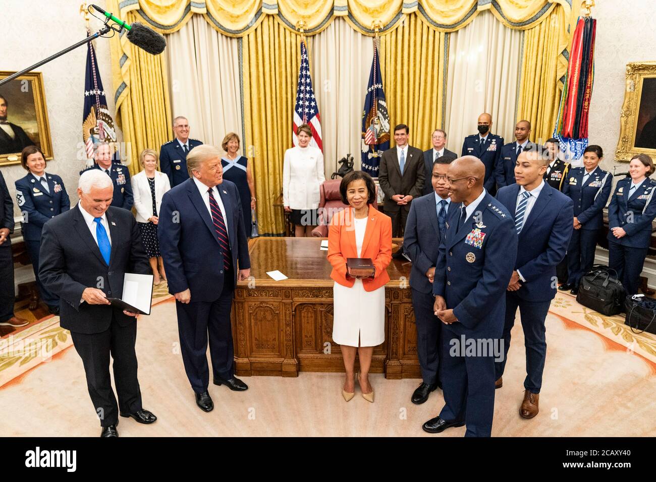 U.S. President Donald Trump and Vice President Mike Pence swear in Air Force General Charles Q. Brown, as the new Air Force Chief of Staff in the Oval Office Room of the White House August 4, 2020 in Washington, DC. Stock Photo