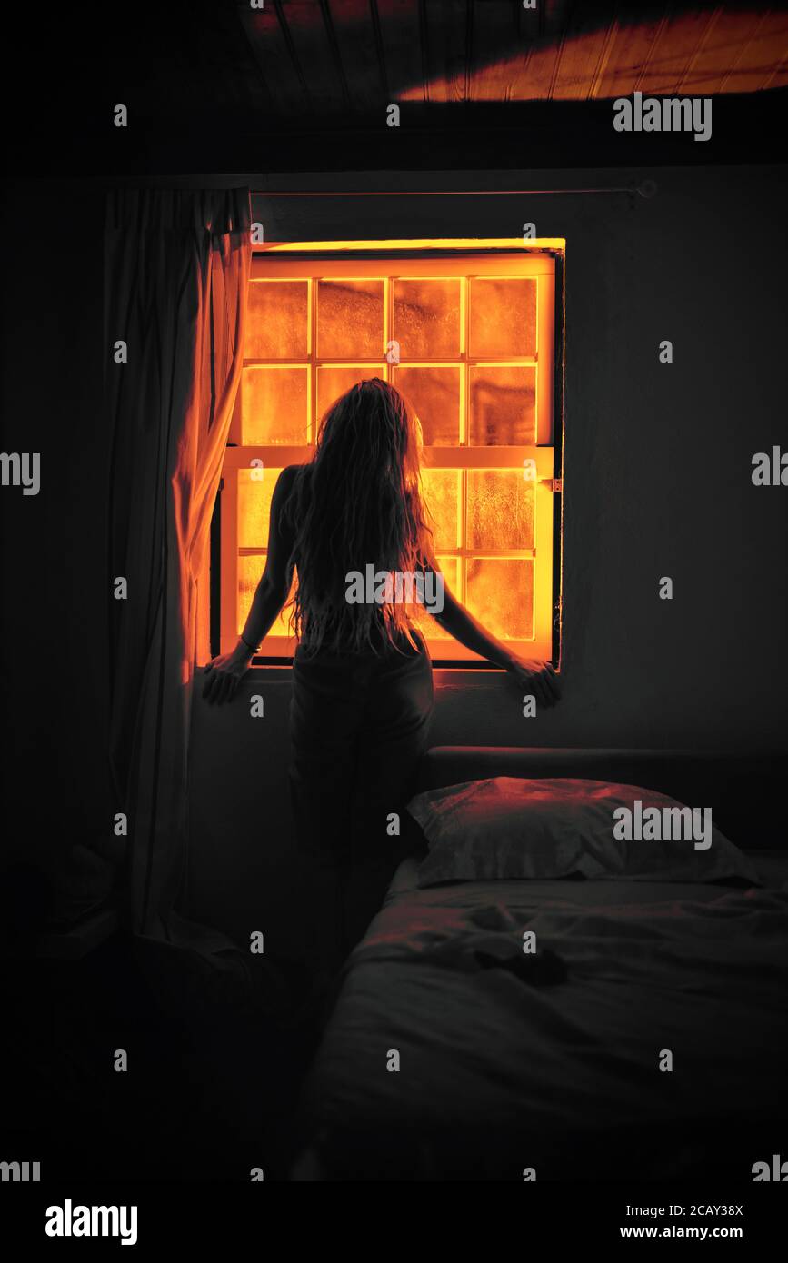 Woman looking out the window hires stock photography and images Alamy