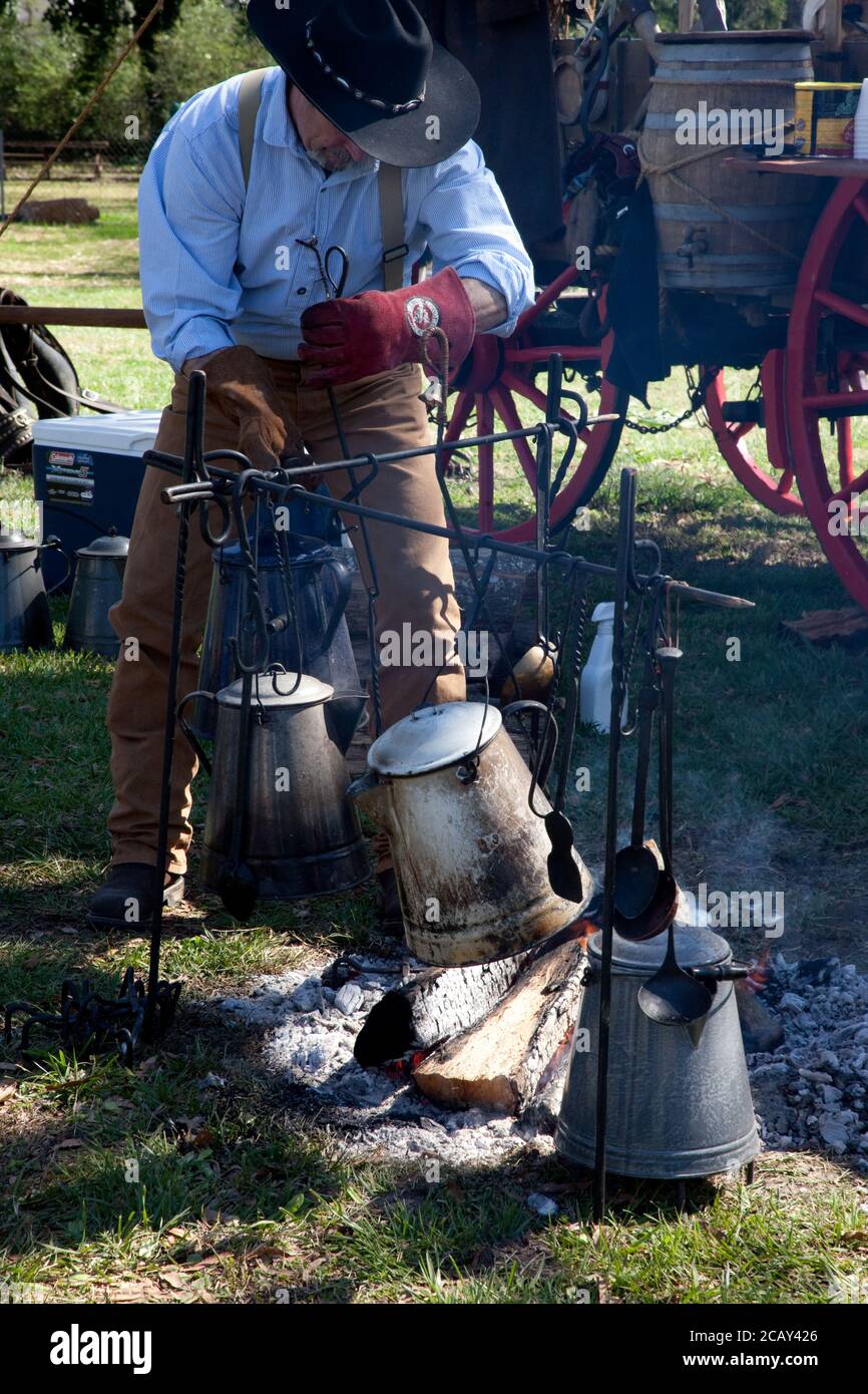 coffee pot boiling over an open fire cowboy flame smoke caffine wild west  Stock Photo - Alamy