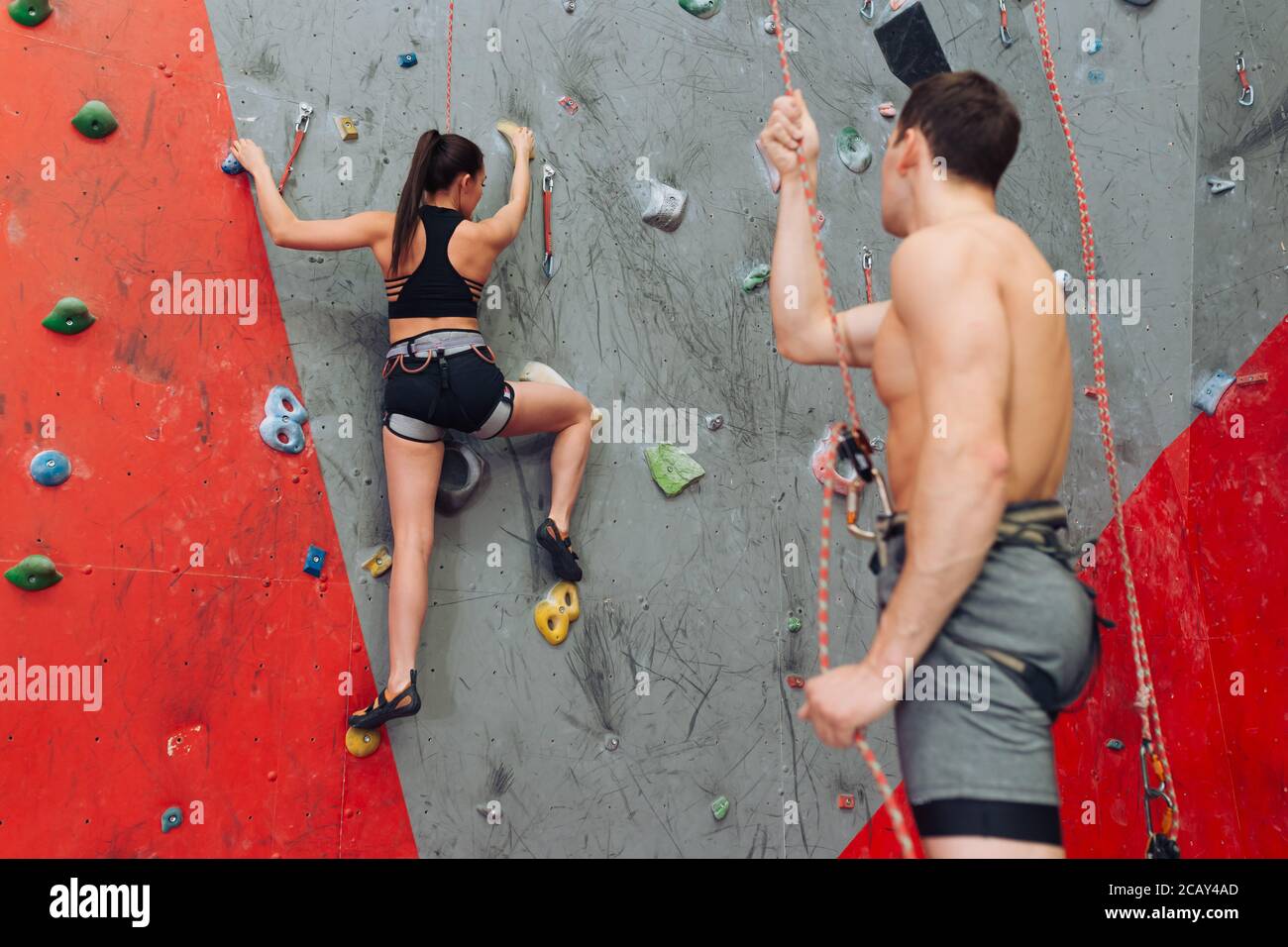 personal instructor worries about the girl's safety. lifestyle. man warning the woman to be attentive Stock Photo