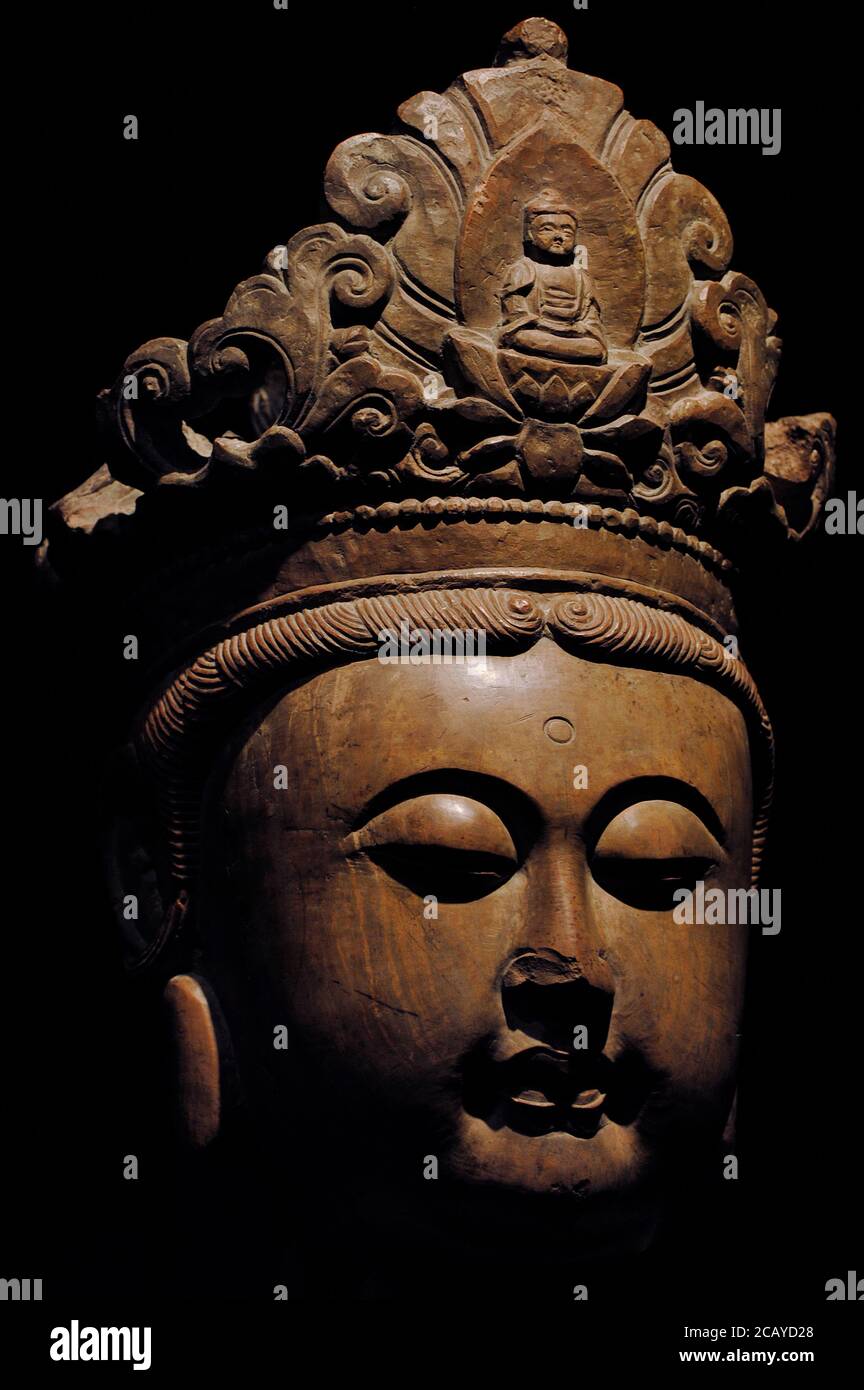 Bodhisattva Avalokitesvara (Kuan-Yin adorned with jewels). Ming Dynasty. 15th-16th centuries. Red stone. From China. Liebieghaus Museum. Frankfurt. Germany. Stock Photo