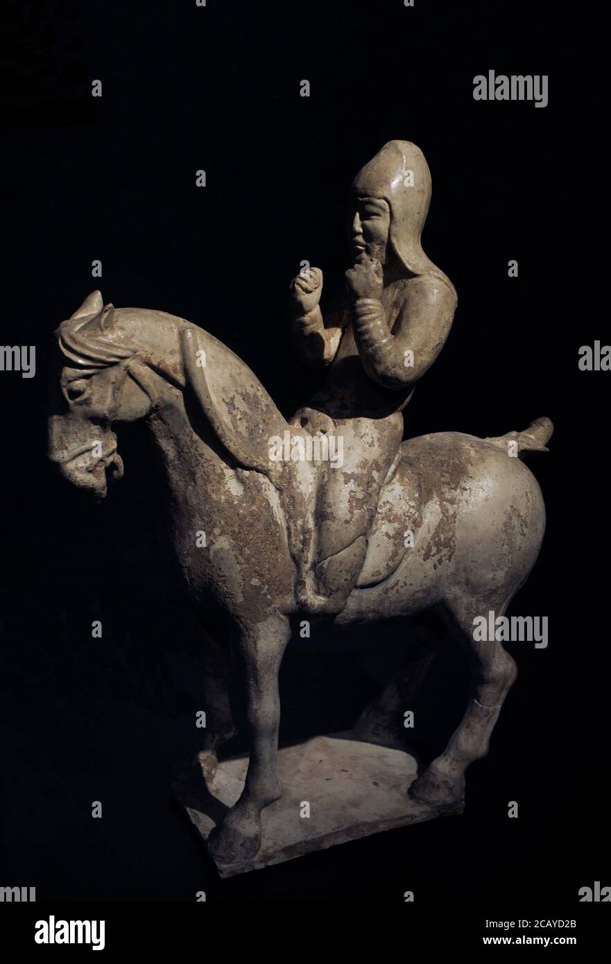 Figure of a horseman (qima yong). Tang Dynasty. 7th century AD. Light-coloured clay with colourless glaze. From China. Liebieghaus Museum. Frankfurt. Germany. Stock Photo