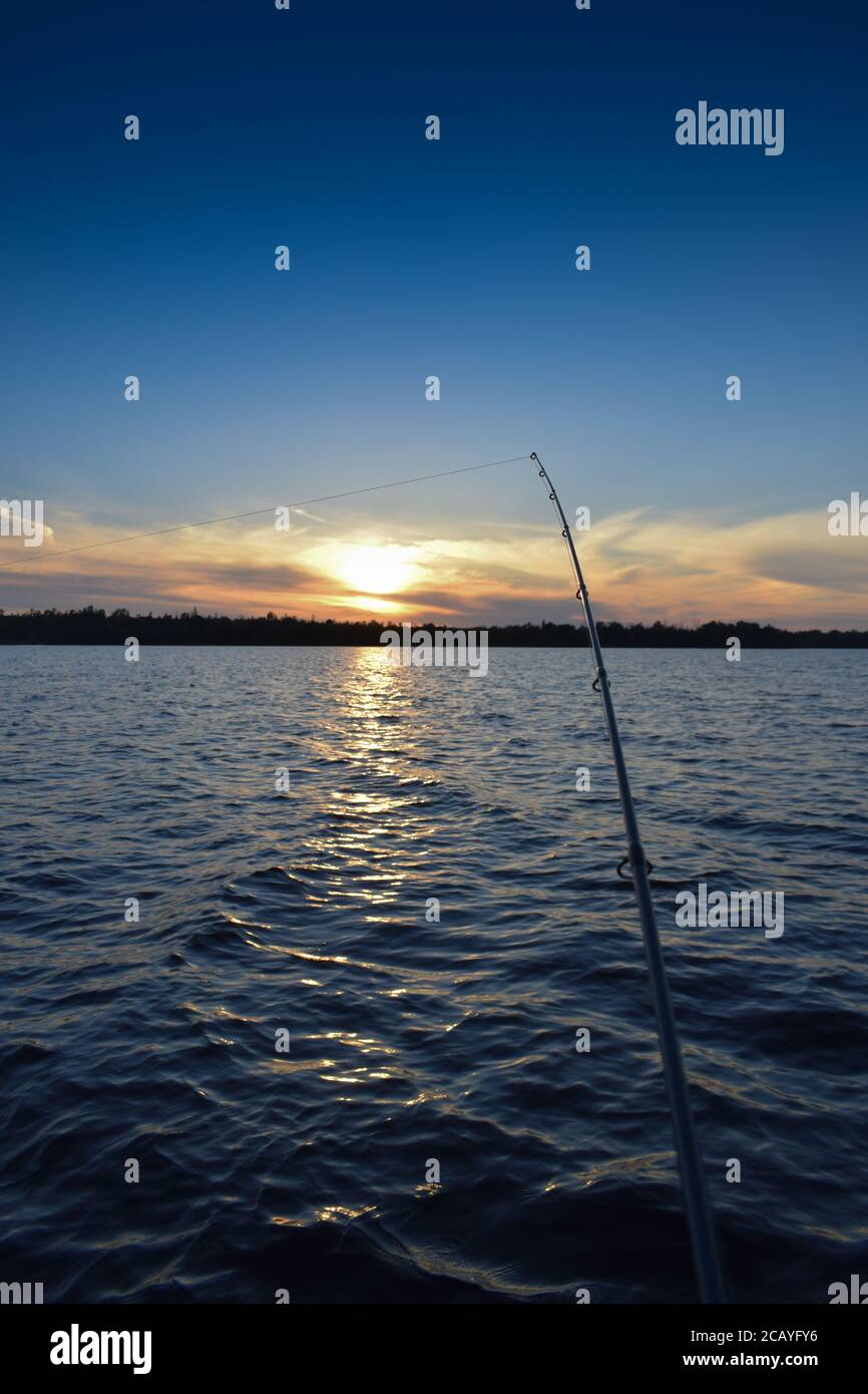Fishing in the dark Stock Photo