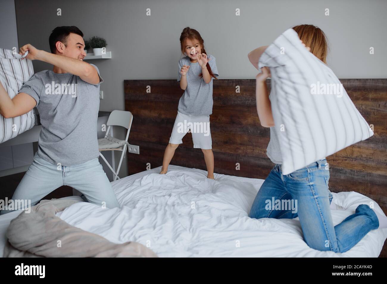 happy caucasian family, mother father and child girl fight play with ...