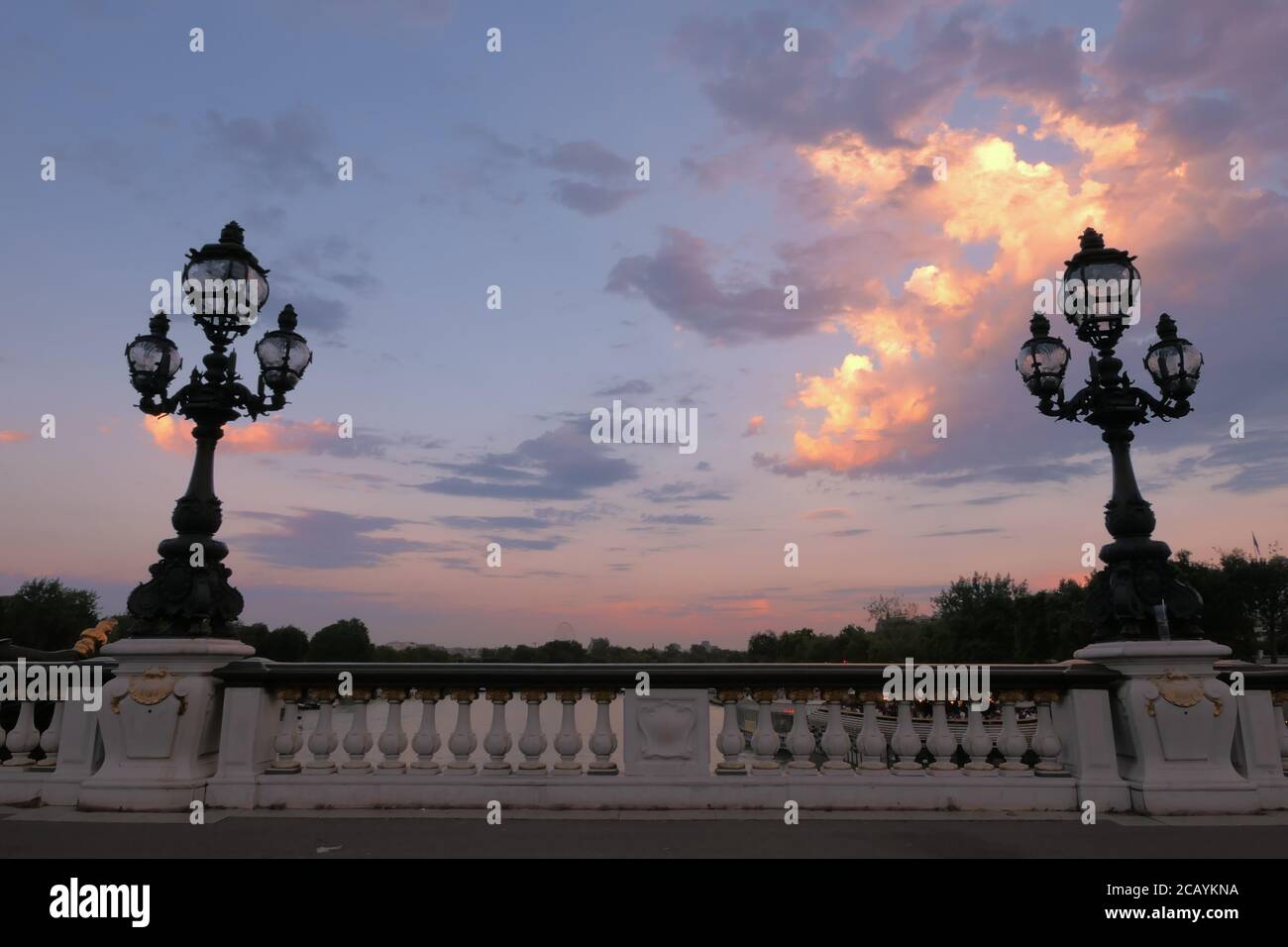 Paris, France. August 08. 2020. Sunset on the famous Alexander 3 Bridge. Historic retro-style lampposts. Very touristy place. Stock Photo