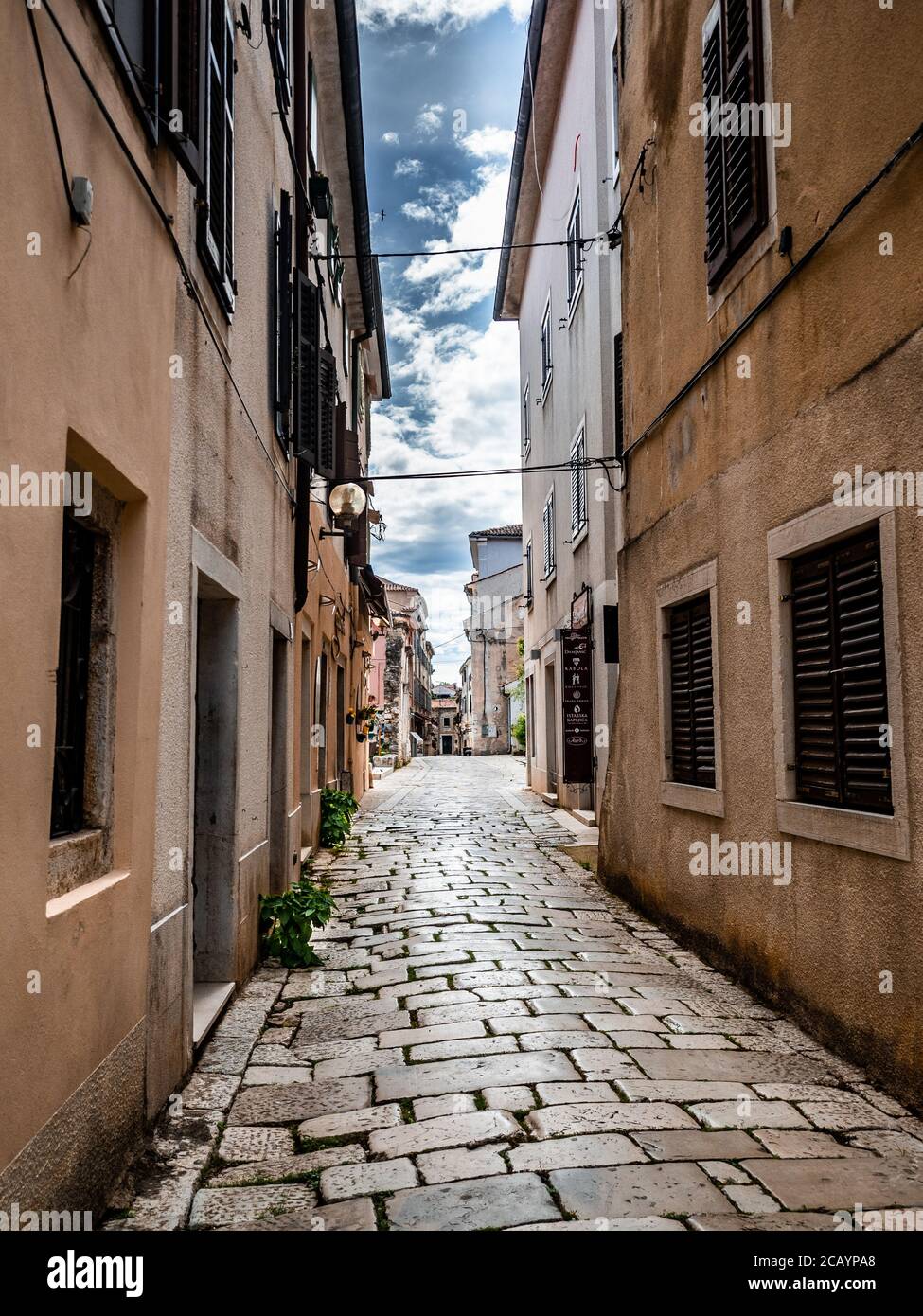 POREC, CROATIA - 6/20/2020: Empty street with no people. Covid-19 pandemic isolation. A symbolic scene of many towns in Europe during coronavirus. Stock Photo