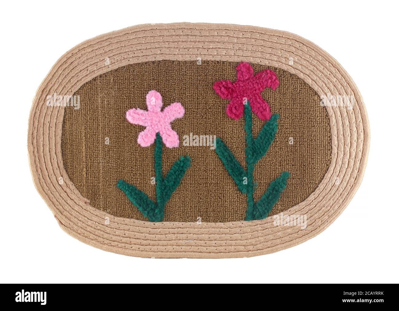 Outdoor mat in front of a door with flower decor isolated on a white