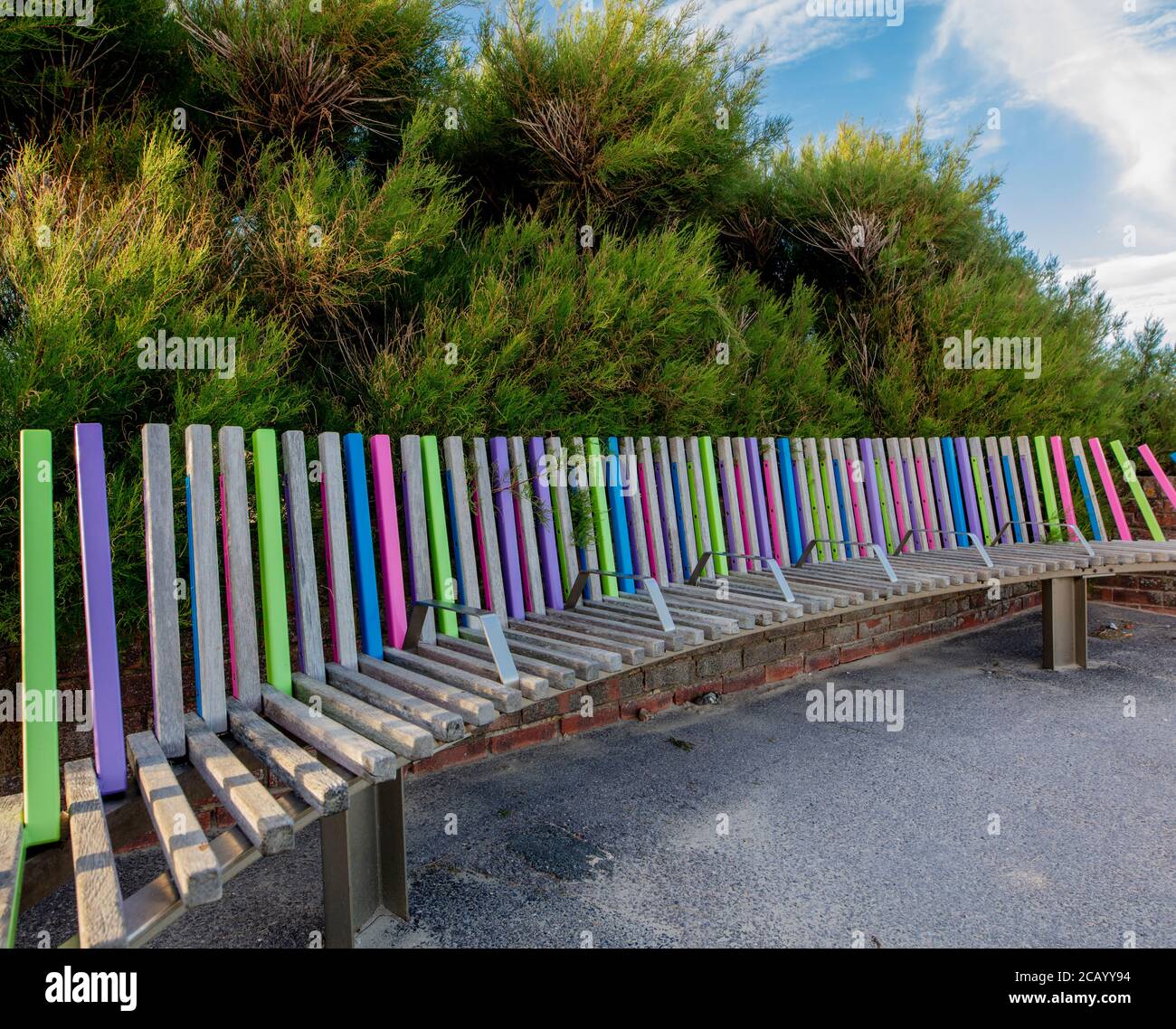 The longest bench in the country; each panel has the name of a sponsor, usually a departed friend or relative, Littlehampton, West Sussex. UK Stock Photo