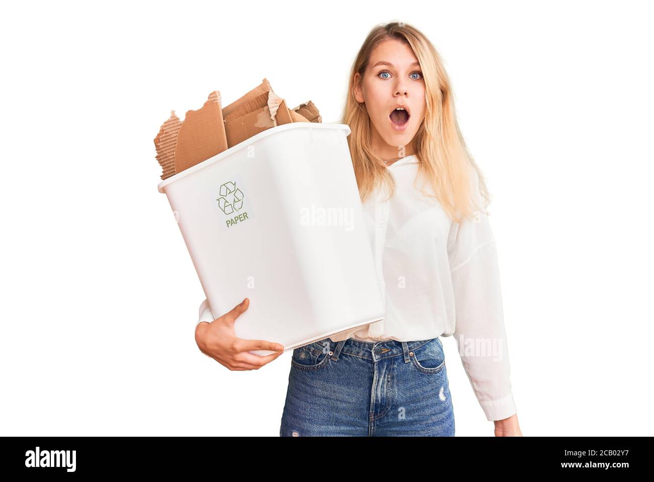 Scared Dustbin Young beautiful blonde woman holding recycle paper bin scared and ...