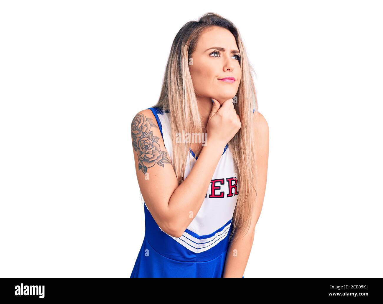 Young beautiful blonde woman wearing cheerleader uniform touching