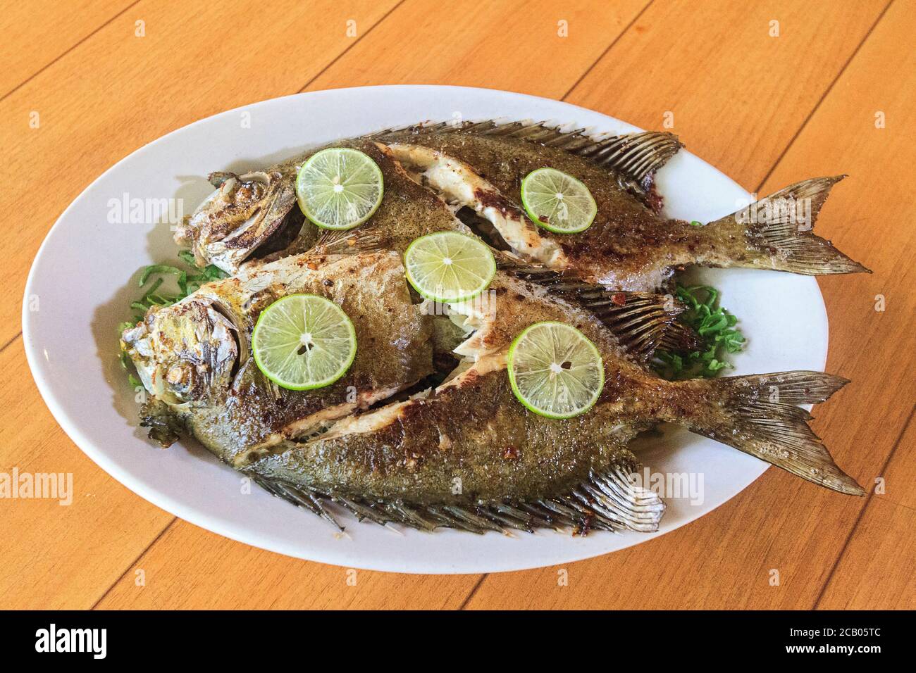 Freshly grilled rabbitfish, known locally in Kosrae, Micronesia as mulap. Stock Photo