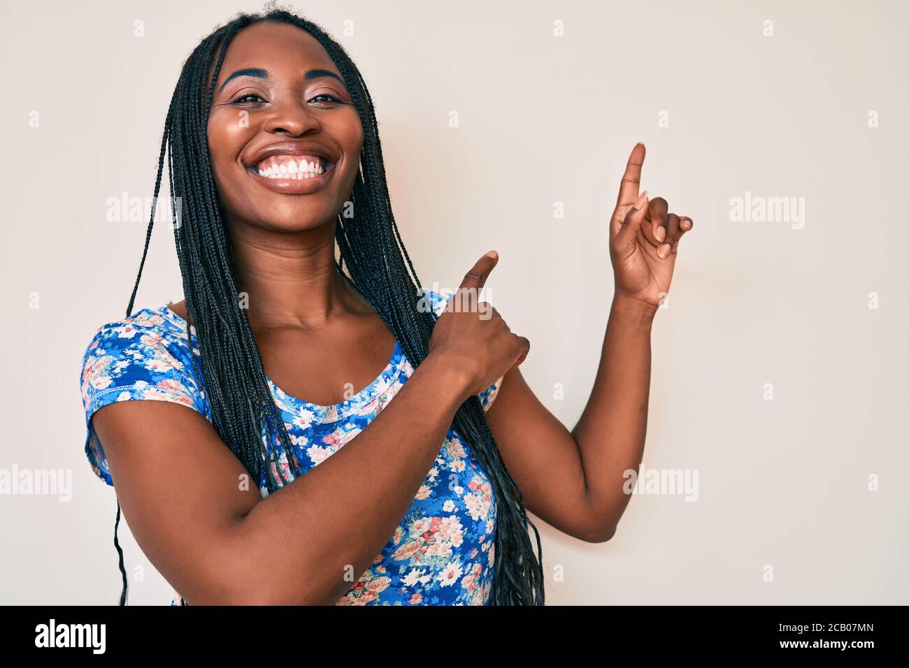 African american woman with braids wearing casual summer clothes ...