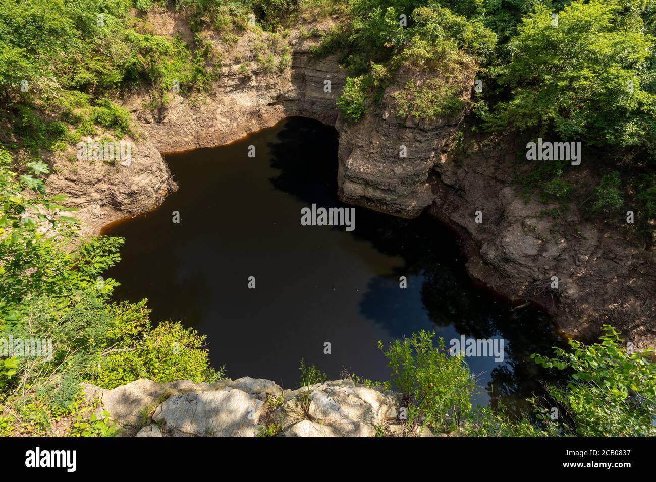 A Pit Of Dark Water Stock Photo