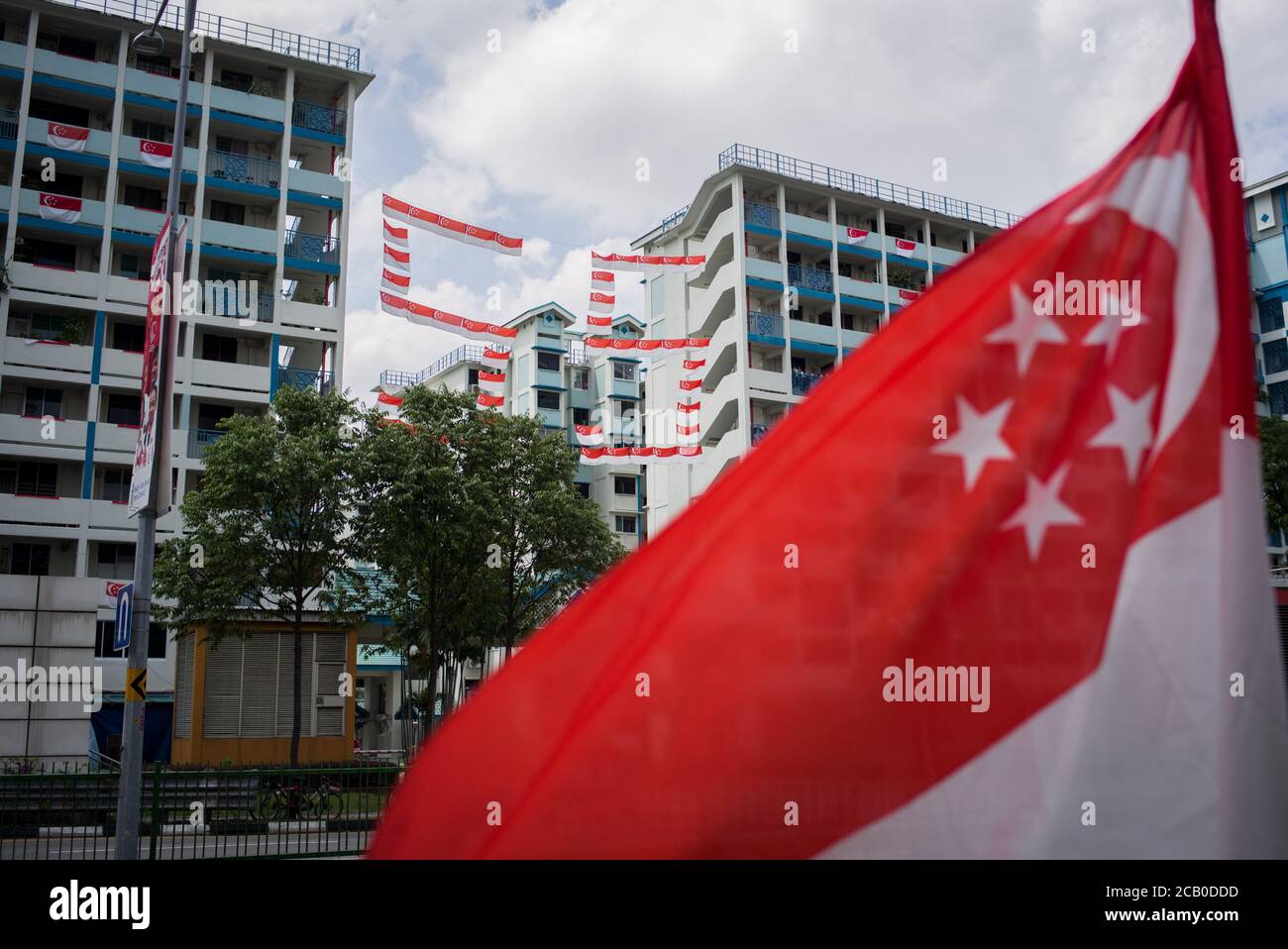 A number 55 that was made up of Singapore flags seen hanging in between