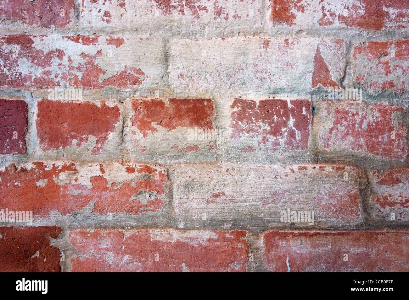 Red and white brick wall background with vintage bricks, mortar and