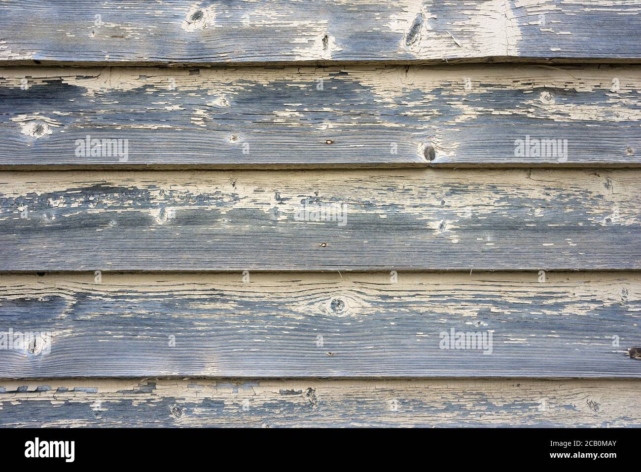Weathered wood background texture with abstract yellow paint surface and horizontal patterns. Stock Photo