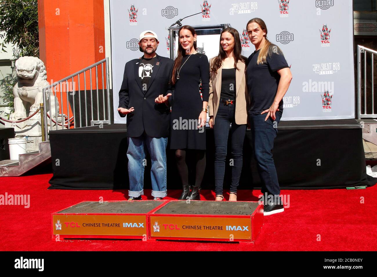 LOS ANGELES - OCT 14:  Kevin SMith, Jennifer Schwalbach Smith, Jordan Monsanto, Jason Mewes at the Kevin Smith And Jason Mewes Hand And Footprint Ceremony at the TCL Chinese Theater on October 14, 2019 in Los Angeles, CA Stock Photo