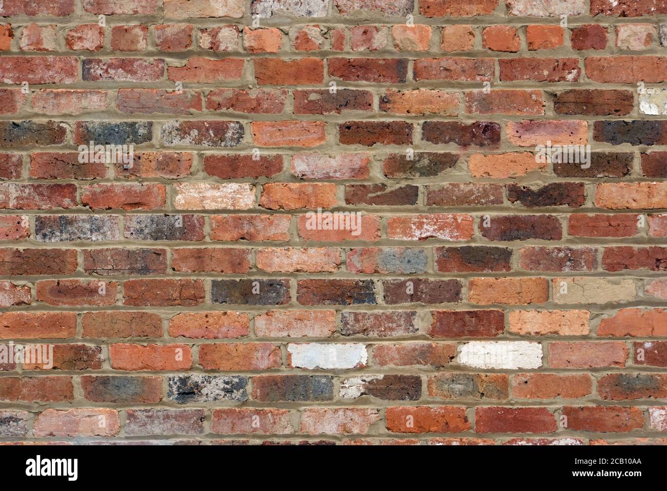 Weathered brick wall texture background showing vintage bricks, mortar and abstract patterns. Stock Photo