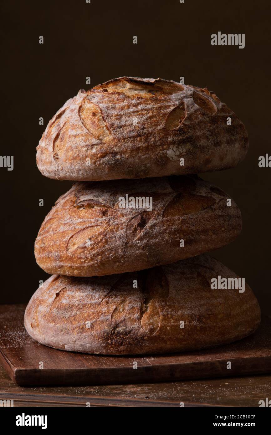 Freshly baked sourdough bread with floral decoration on it Stock Photo