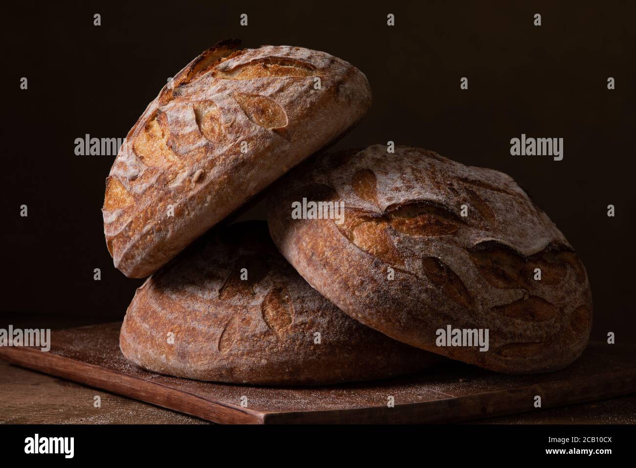 Freshly baked sourdough bread with floral decoration on it Stock Photo