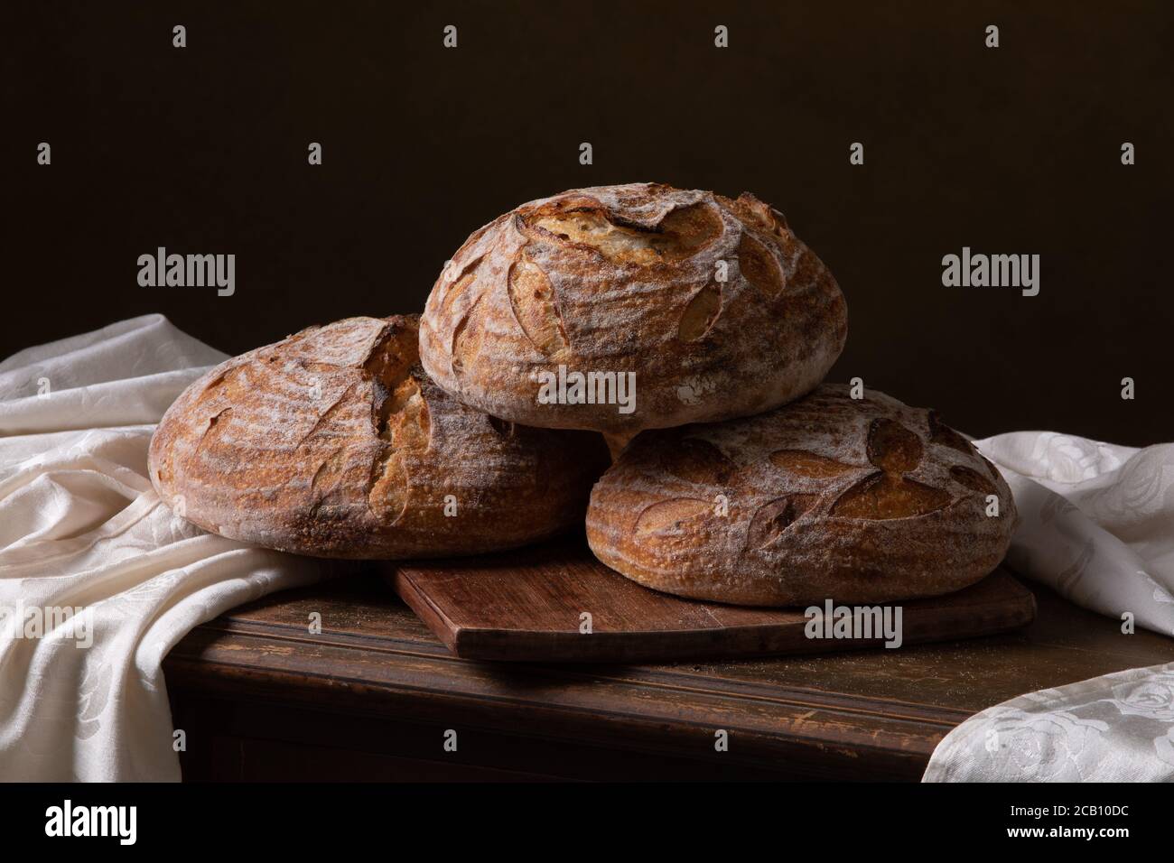 Freshly baked sourdough bread with floral decoration on it Stock Photo
