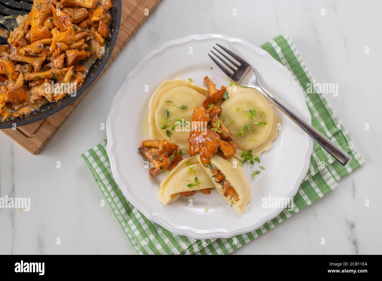 home made Italian ravioli with fresh roasted chanterelles Stock Photo