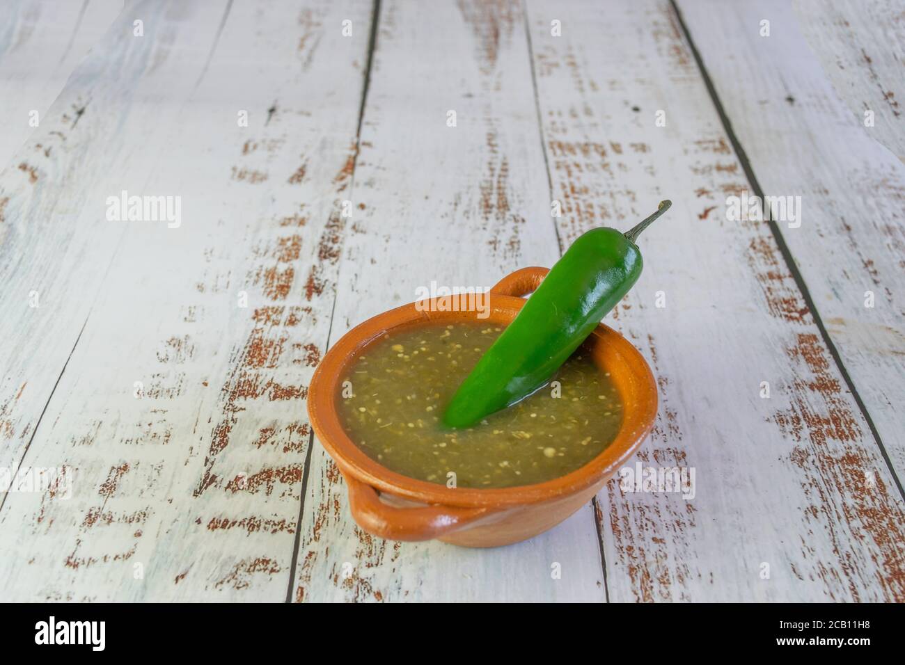 mexican green sauce with serrano chili Stock Photo Alamy